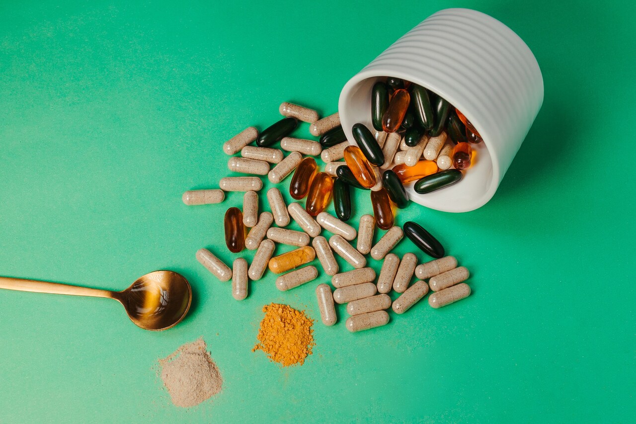 Home 11 green-tabletop-with-an-array-of-vitamin-supplement-2025-02-11-16-52-54-utc_Easy-Resize.com
