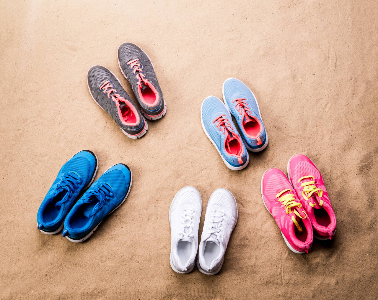 various-sports-shoes-laid-on-sand-beach-studio-sh-2024-10-18-17-47-21-utc_Easy-Resize.com