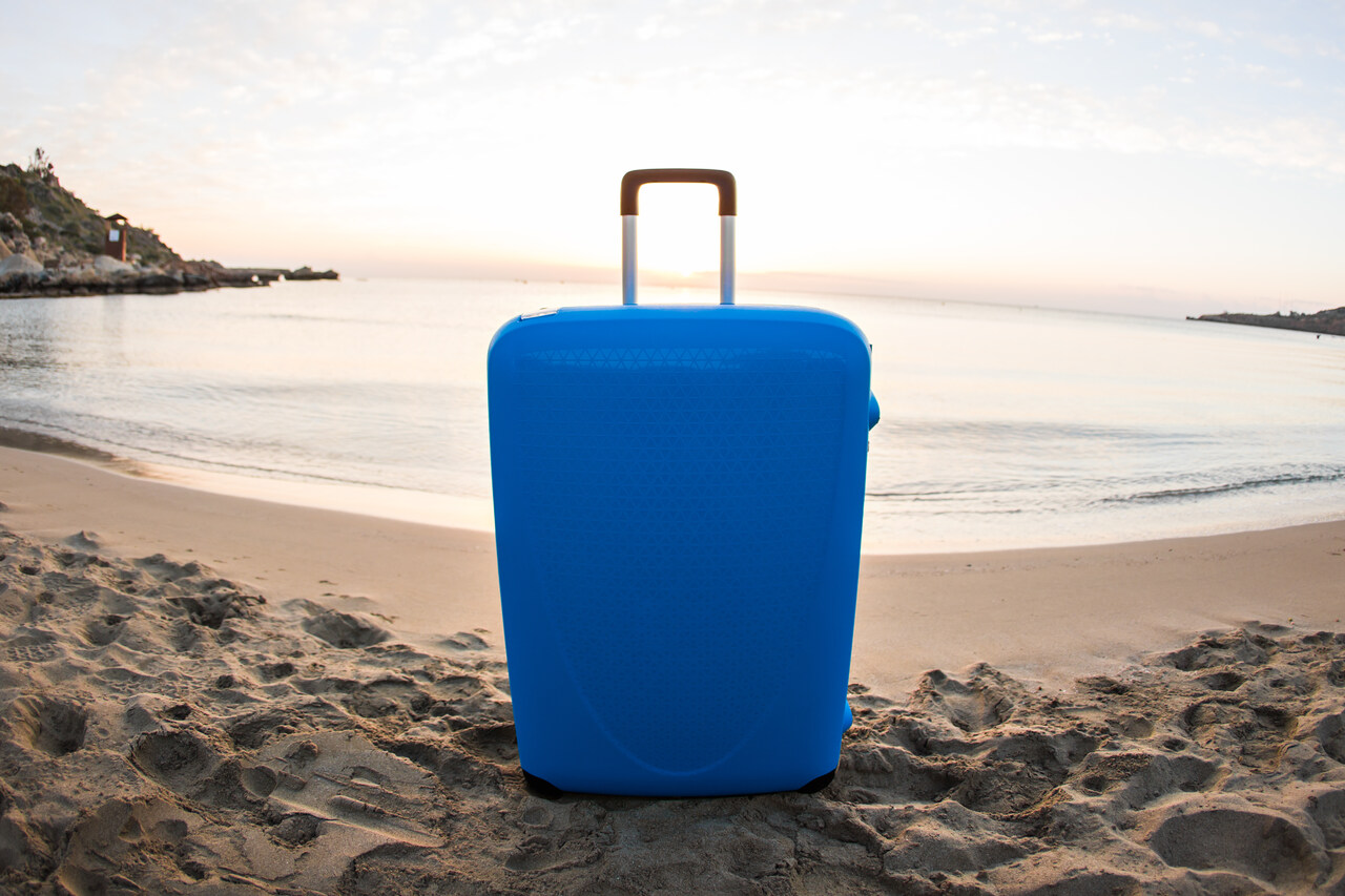 Home 8 travel-holiday-and-vacation-concept-blue-suitca-2025-02-25-10-34-06-utc_Easy-Resize.com